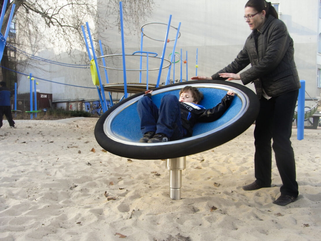 Parent spinning child around in the Kalotta Turner